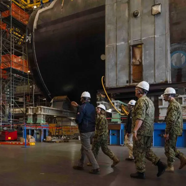 Vice Chief of Naval Operations Adm. Lisa Franchetti tours General Dynamics Electric Boat’s Quonset Point facility in Rhode Island, where modular construction and outfitting operations support future Virginia-class and Columbia-class submarines as the U.S. Navy accelerates AI-enabled submarine production modernization.