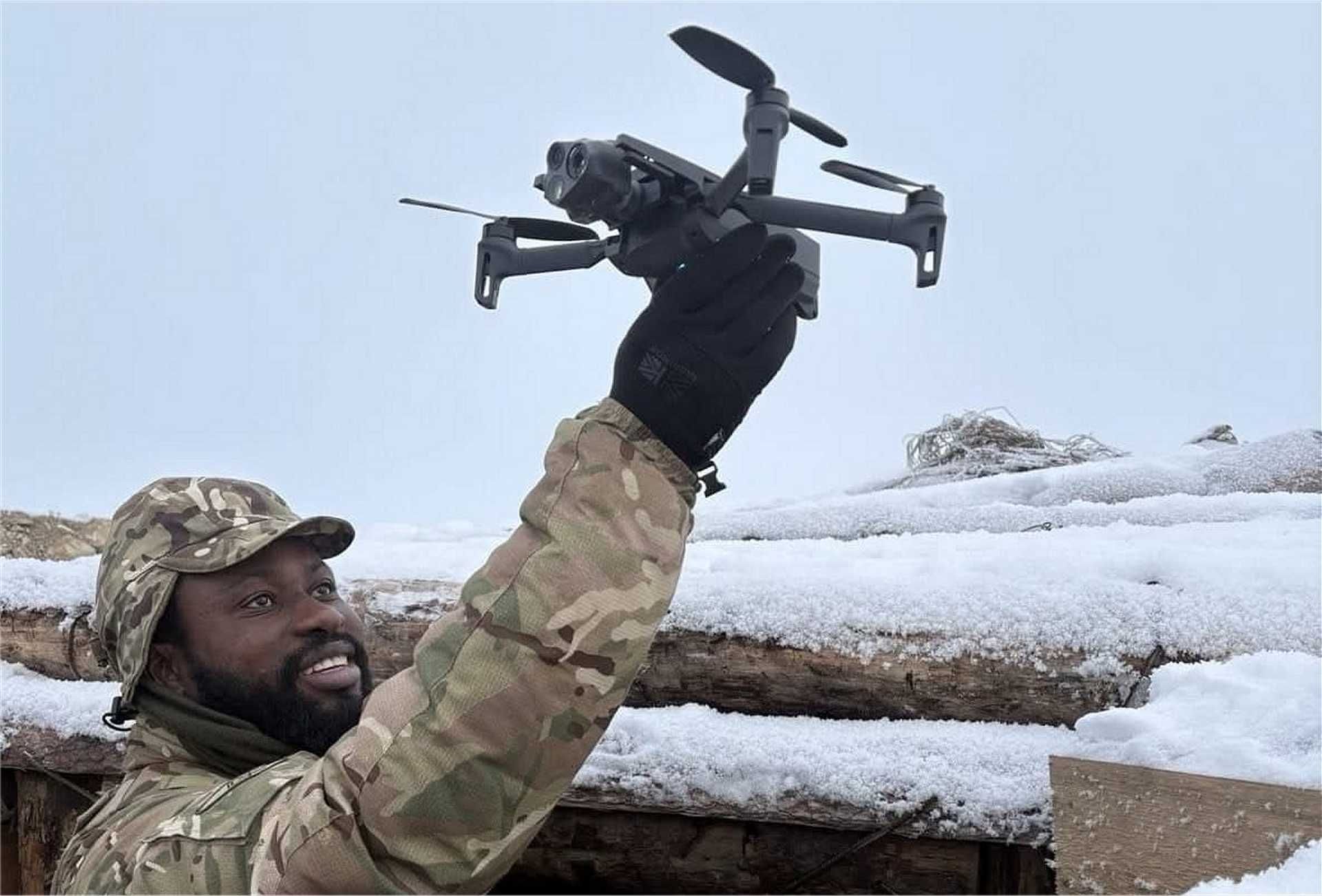 British soldiers from Dreadnaught Squadron, Royal Tank Regiment, operate a small tactical drone during sUAS training in Estonia, enhancing battlefield reconnaissance capabilities in coordination with NATO forces.