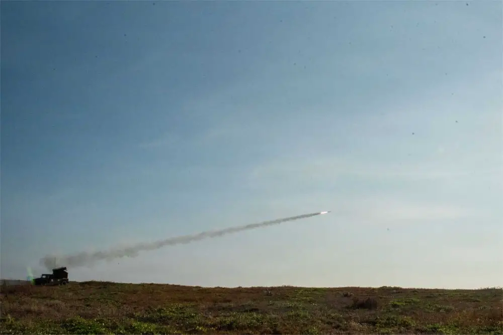 An AN/TWQ-1 Avenger short-range air defense system operated by Echo Battery, 6th Battalion, 52nd Air Defense Artillery Regiment, launches an FIM-92 Stinger missile to intercept and destroy a Griffon Aerospace MQM-170C Outlaw G2 Group 3 drone during an integrated air and missile defense live-fire exercise at Naval Station Leovigildo Gantioqui, Philippines, as part of Exercise Balikatan 2026 on April 27, 2026.