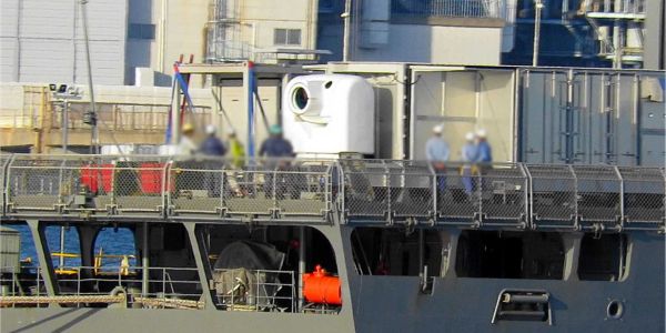 Japanese Navy experimental test ship JS Asuka undergoing integration of ATLA’s 100kW-class laser weapon system at JMU Isogo shipyard, marking a critical step toward Japan’s first at-sea trials of a high-energy directed-energy weapon.