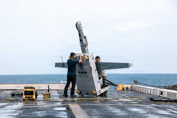 U.S. Department of War contractors prepare a VBAT vertical take-off and landing (VTOL) unmanned aerial system for launch aboard the San Antonio-class amphibious transport dock ship USS Portland (LPD 27) during operations in the Pacific Ocean on June 9, 2026. (Picture source: U.S. DoD)