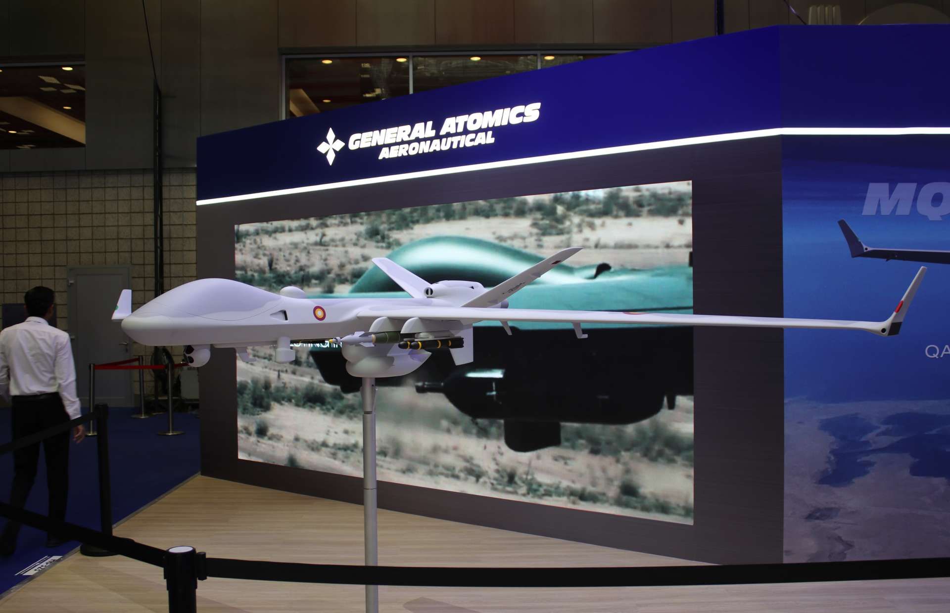 An armed MQ-9B SeaGuardian configured with AGM-114R2 Hellfire missiles and 500-pound precision-guided munitions, illustrating its ability to conduct long-endurance maritime surveillance combined with pinpoint strikes against surface vessels, coastal targets, and time-sensitive threats in contested littoral environments (Picture source: Army Recognition Group).