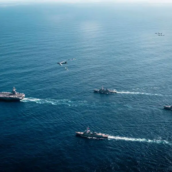 The U.S. Navy’s Gerald R. Ford Carrier Strike Group, with its escorts, embarked F/A-18E/F Super Hornets from Strike Fighter Squadrons 31, 37, 87, and 213, operates alongside a U.S. Air Force B-52 Stratofortress as a joint multi-domain force on 13 November 2025.
